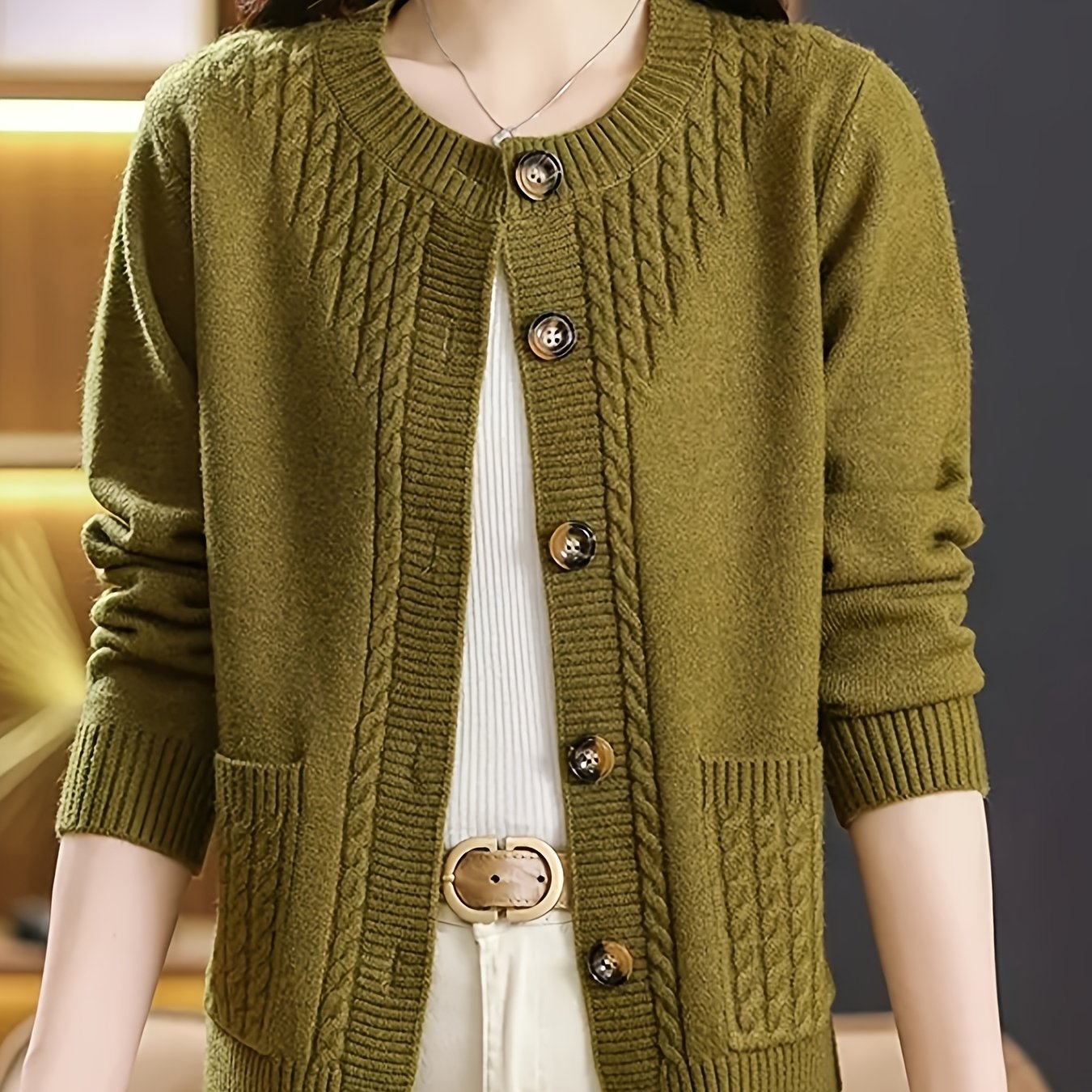 New Spring Collection for Women: Loose-fitting cardigan with round neck, solid color, and unique design, featuring long sleeves.