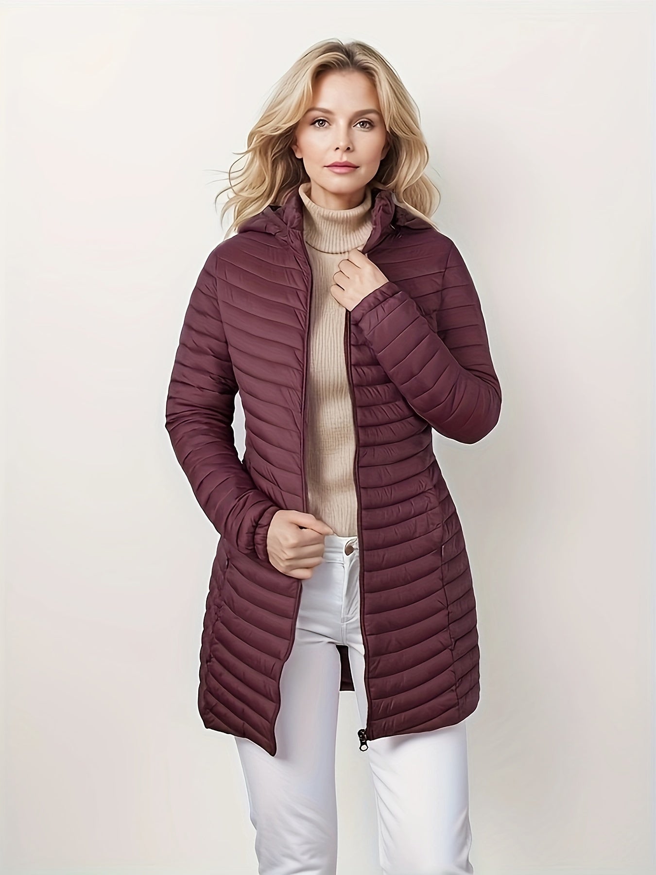 Women's lightweight puffer coat with detachable hood, perfect for winter comfort.