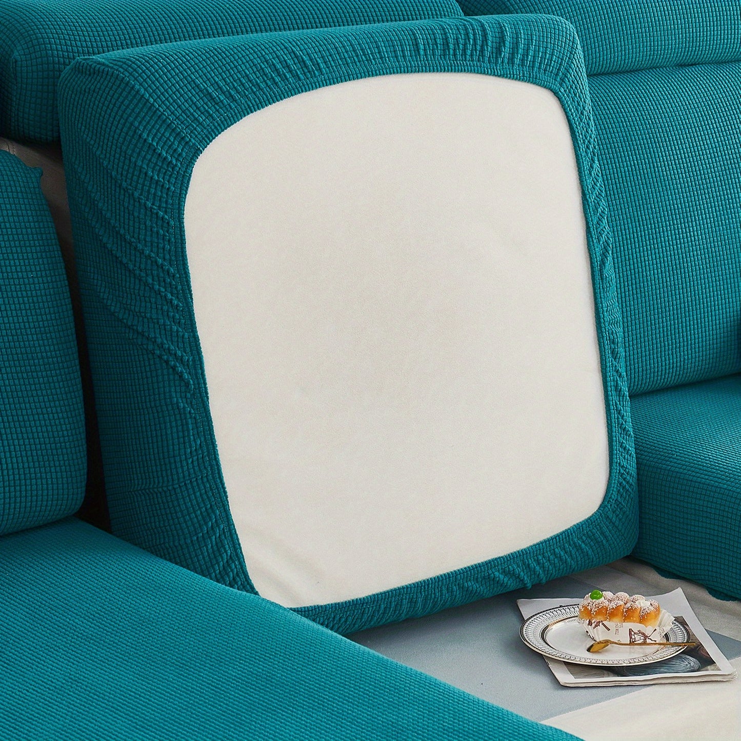 Durable sofa cover protects furniture from spills and stains.