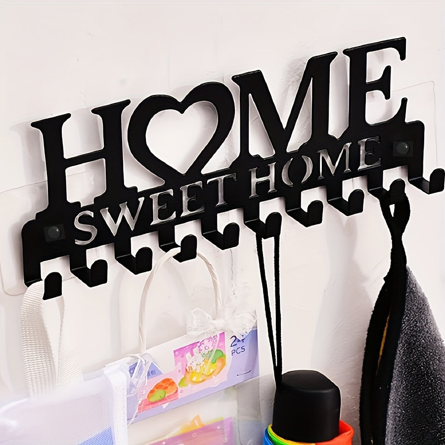 Black metal key holder with decorative hooks for organizing coats, hats, and more. Wall-mounted storage rack for home and hallway. Rust-proof design.