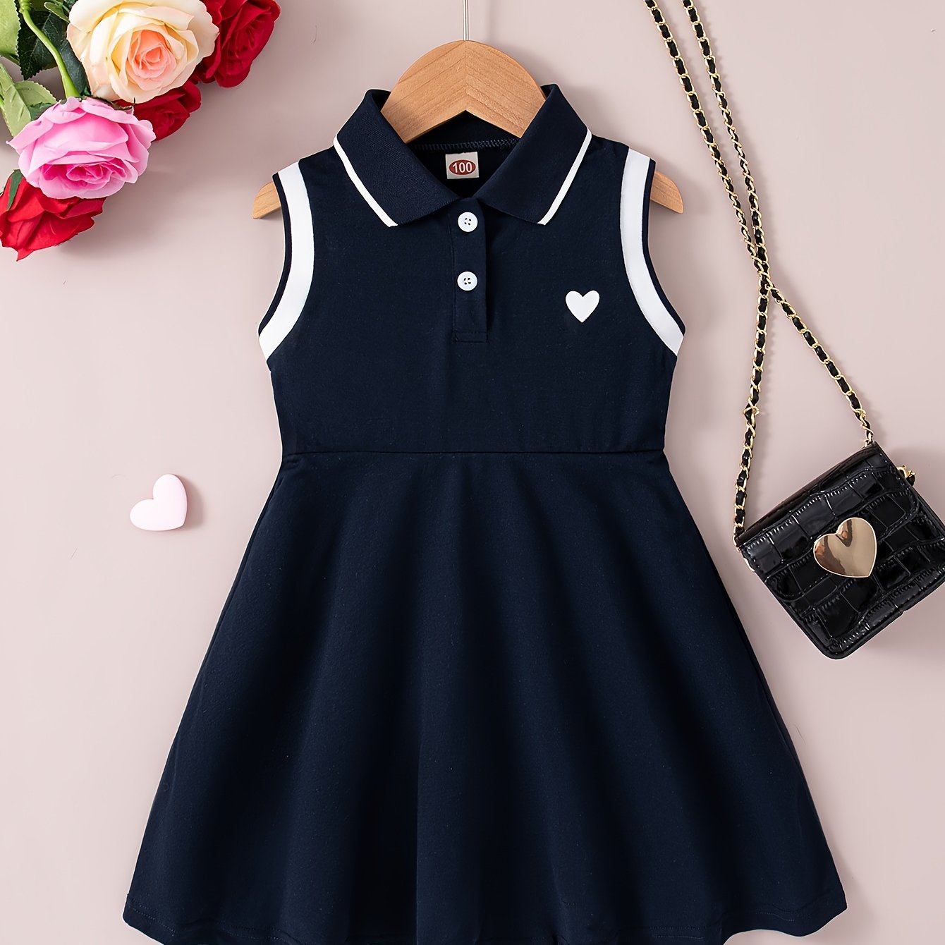 Sleeveless summer girls' dress with collar, heart print, knee-length.