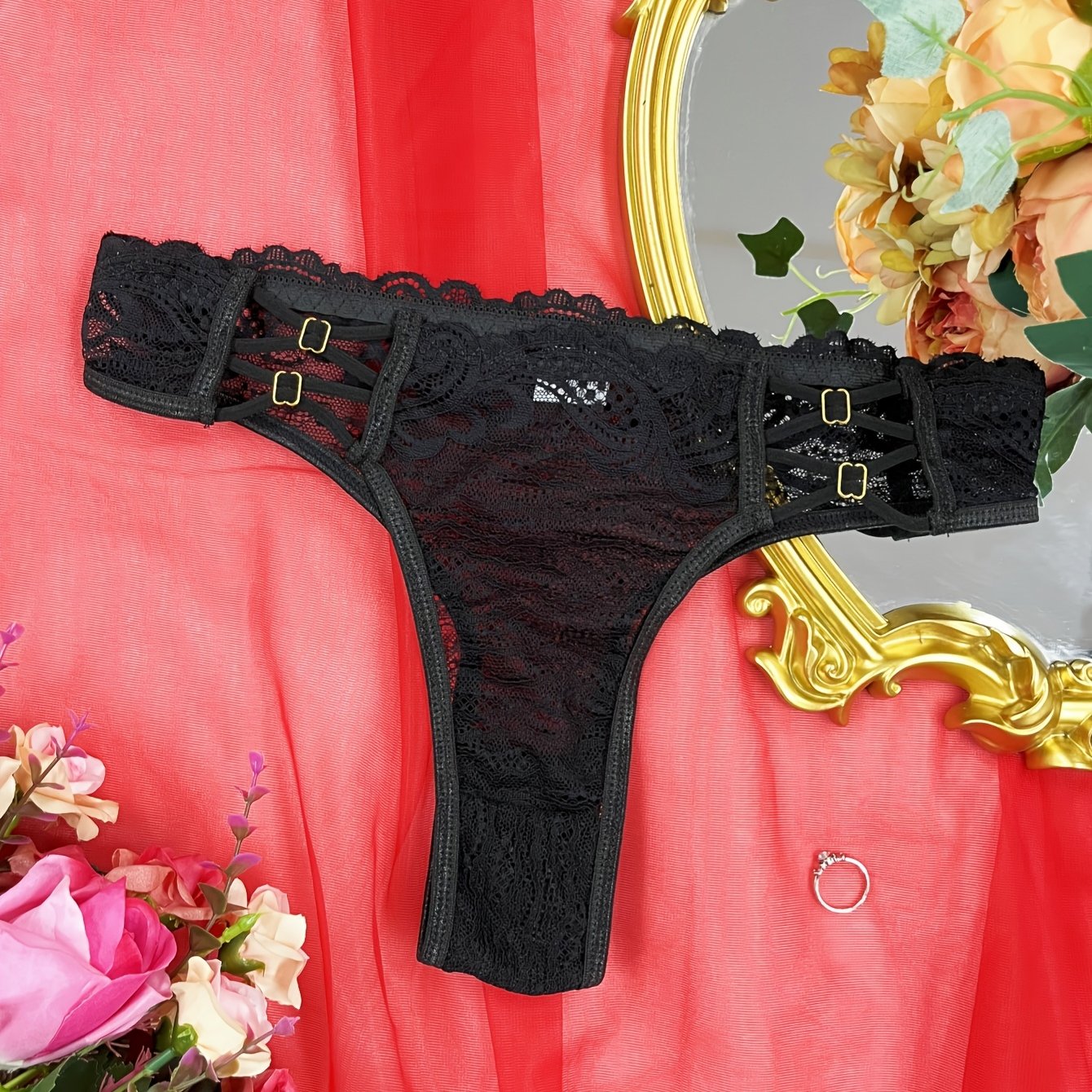 Red lace thong panties for women with floral pattern and scalloped trim. Made of breathable polyester blend that is semi-sheer and hand washable.