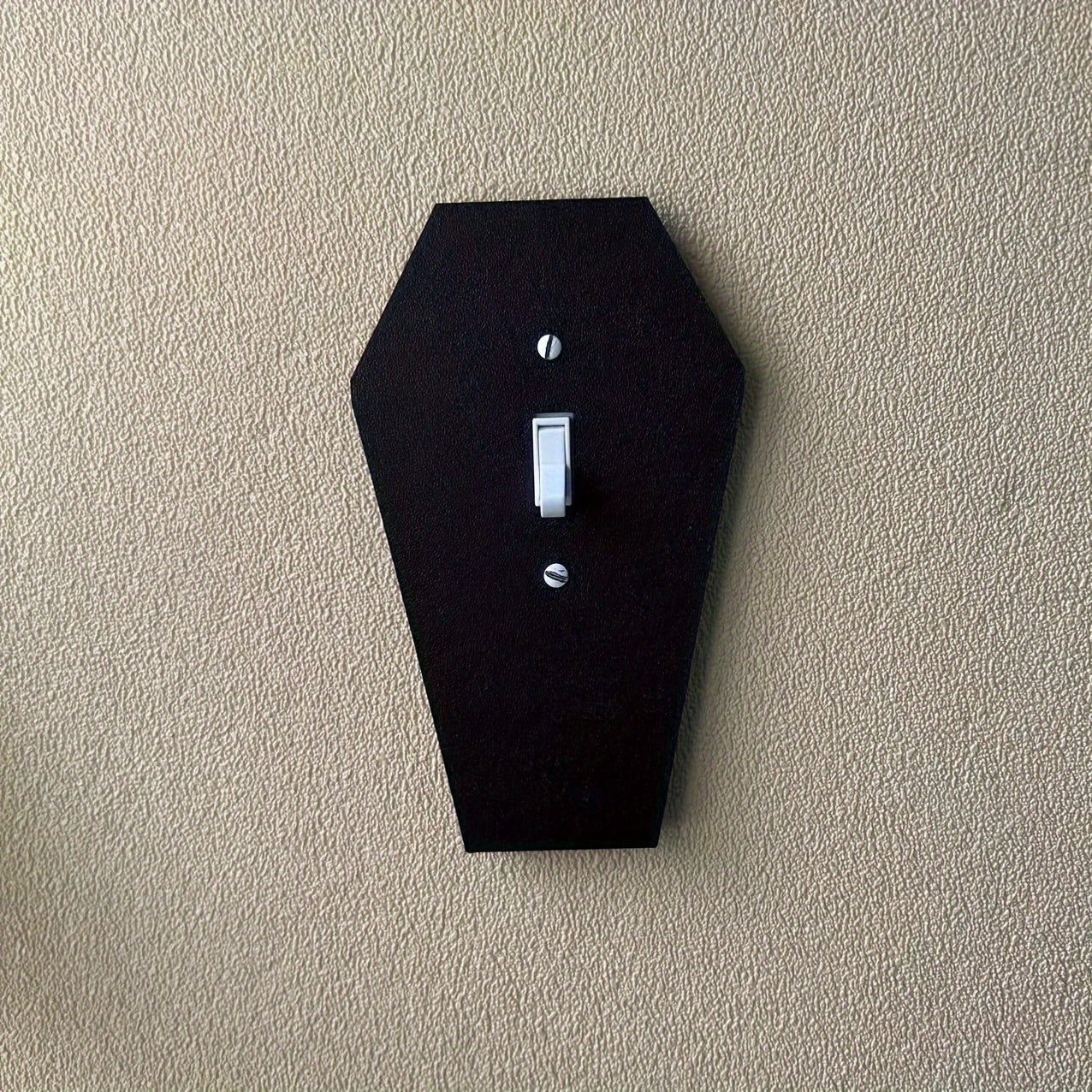 Gothic tombstone wall light with classic black design for easy installation in homes and offices.