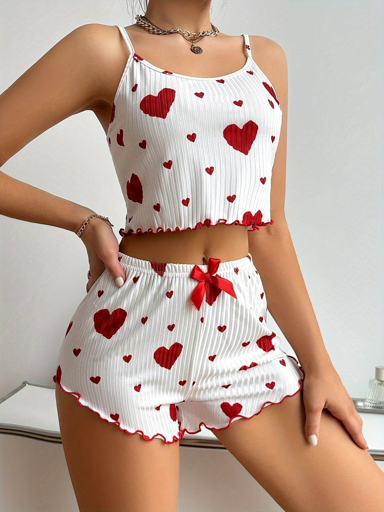 Stylish heart print pajama set for women made of comfy, stretchy polyester blend that is machine washable.