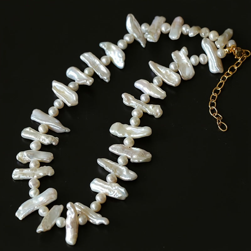 This stunning necklace is inspired by elegant French Baroque style, featuring natural freshwater pearls. The unique clavicle chain is perfect for women to wear on vacations and parties. It comes packaged in a gift box. Please note that natural pearls may