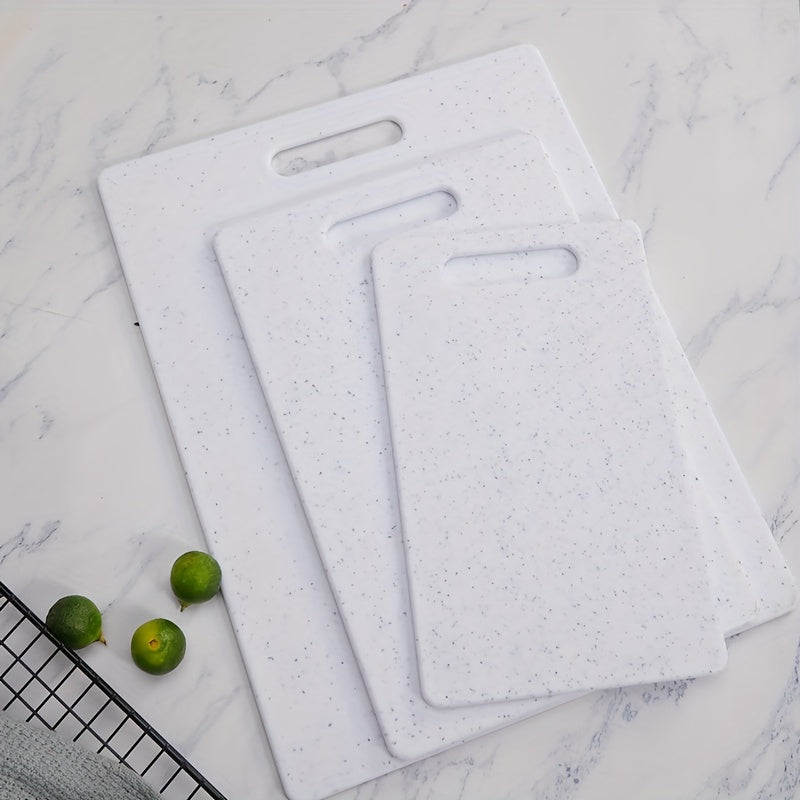 Set of three cutting boards with a marble pattern made of food-safe polystyrene. Suitable for chopping fruits and vegetables, these boards are durable, easy to clean, and feature a stylish black and white marble design.