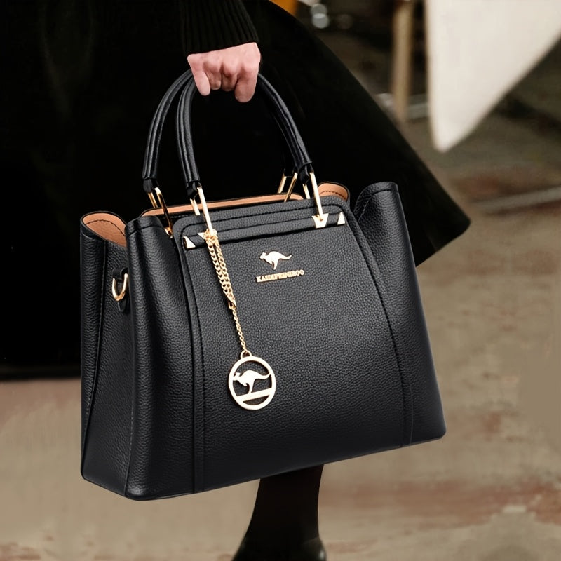 Stylish black synthetic leather handbag for women, with detachable shoulder strap, golden-tone hardware, and anti-theft design. Perfect for work, parties, and gifts.