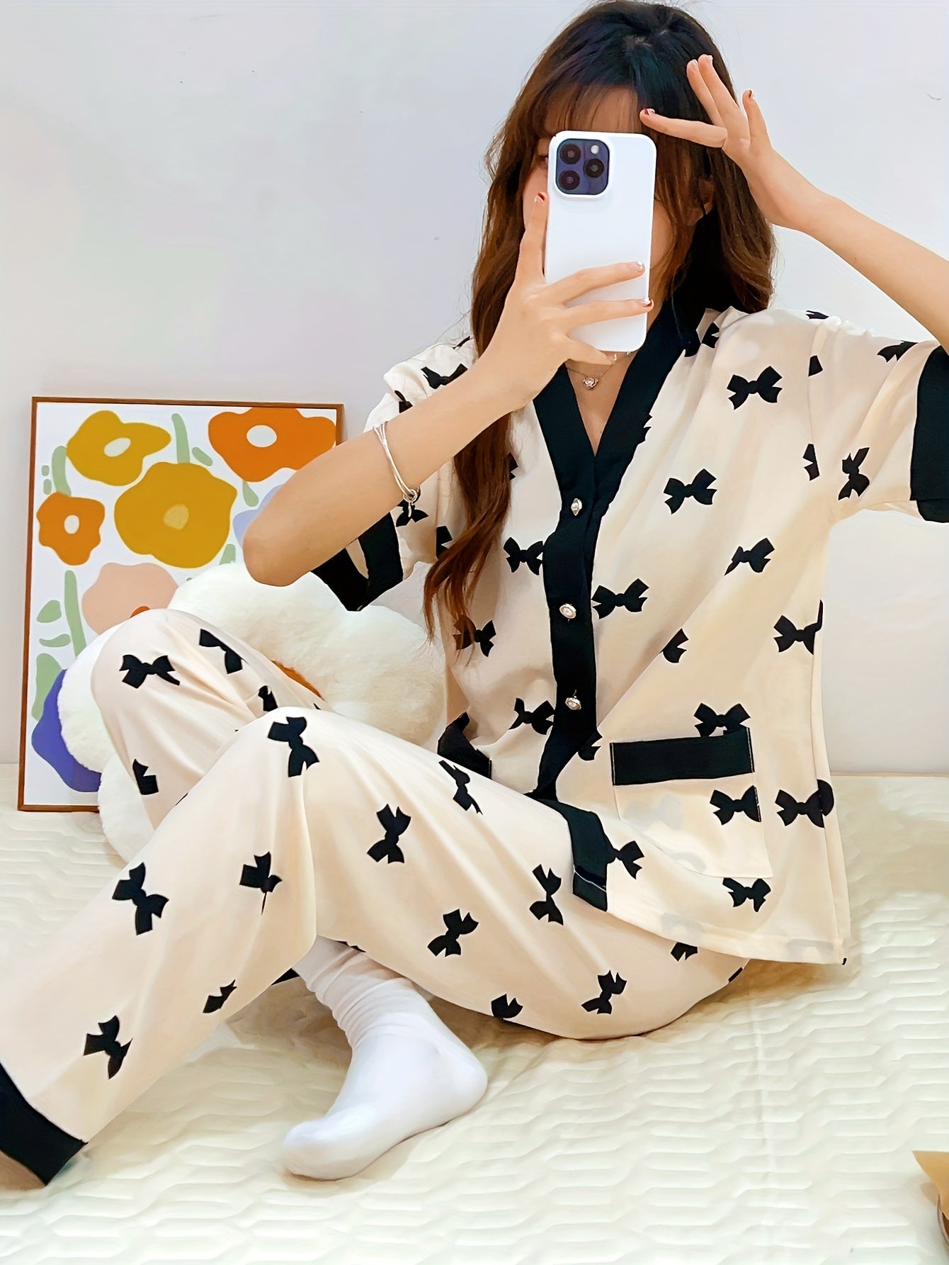 Summery short-sleeved women's pajama suit with sweet V-neck cardigan and thin material perfect for summer.