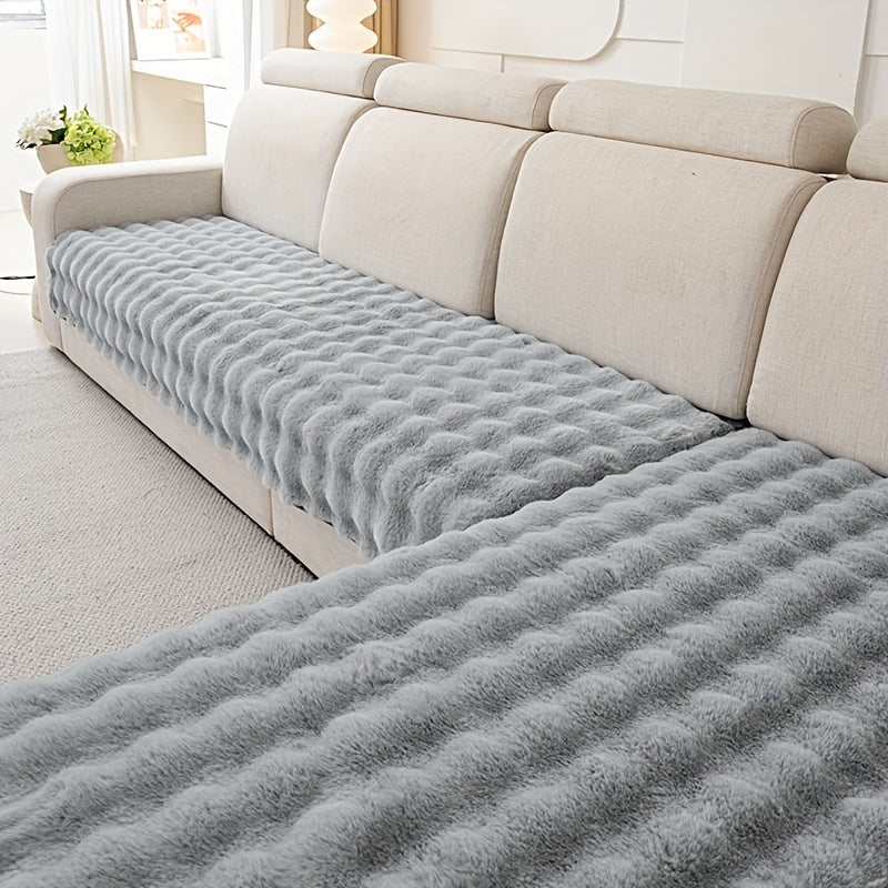 Luxurious faux rabbit fur sofa pads for winter warmth, pet-friendly, non-slip, machine washable, fits 2/3/4-seater sofas in grey color.