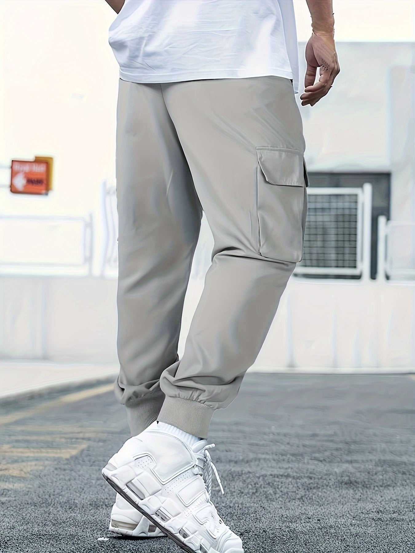 Japanese men's casual work pants with multiple pockets and loose, tied feet for spring 2023