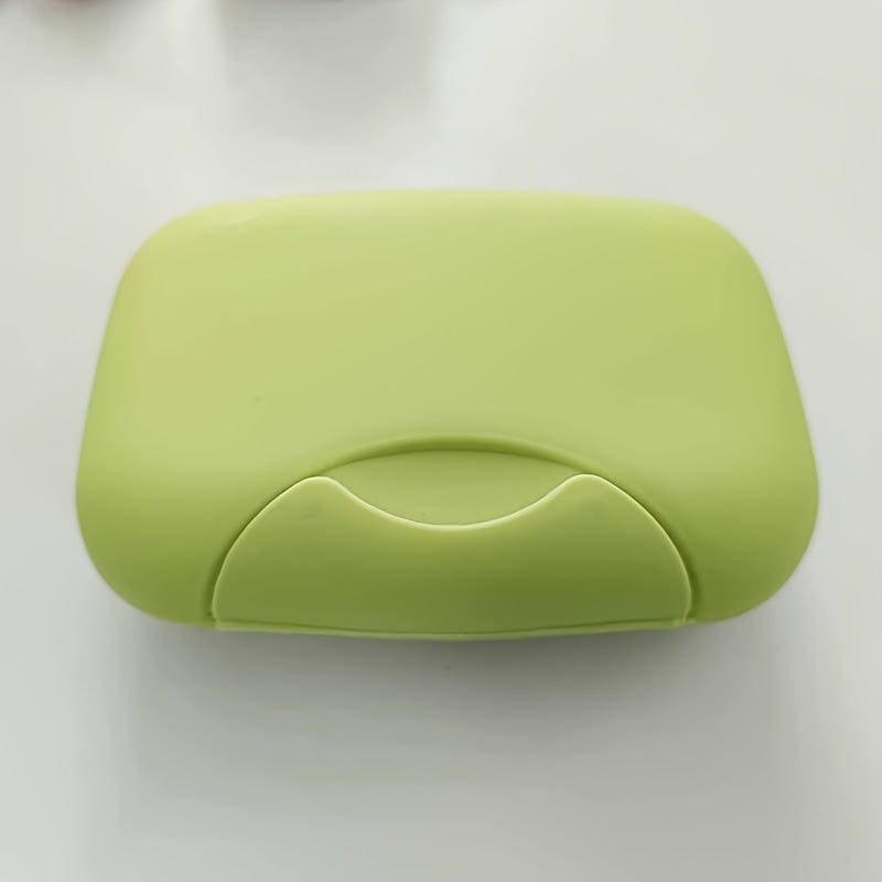 Plastic soap box with lid for travel, camping, or gym use. Waterproof and portable. Perfect for storing soap on the go.