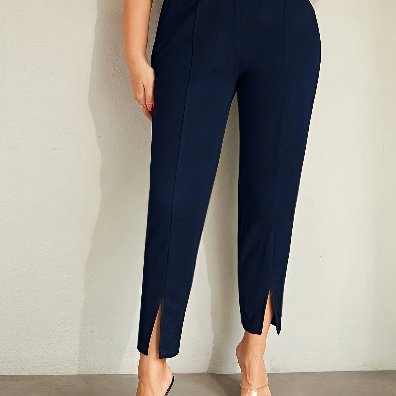 Stylish plus size high waist slim-fit pants with side slits in solid color, machine washable.