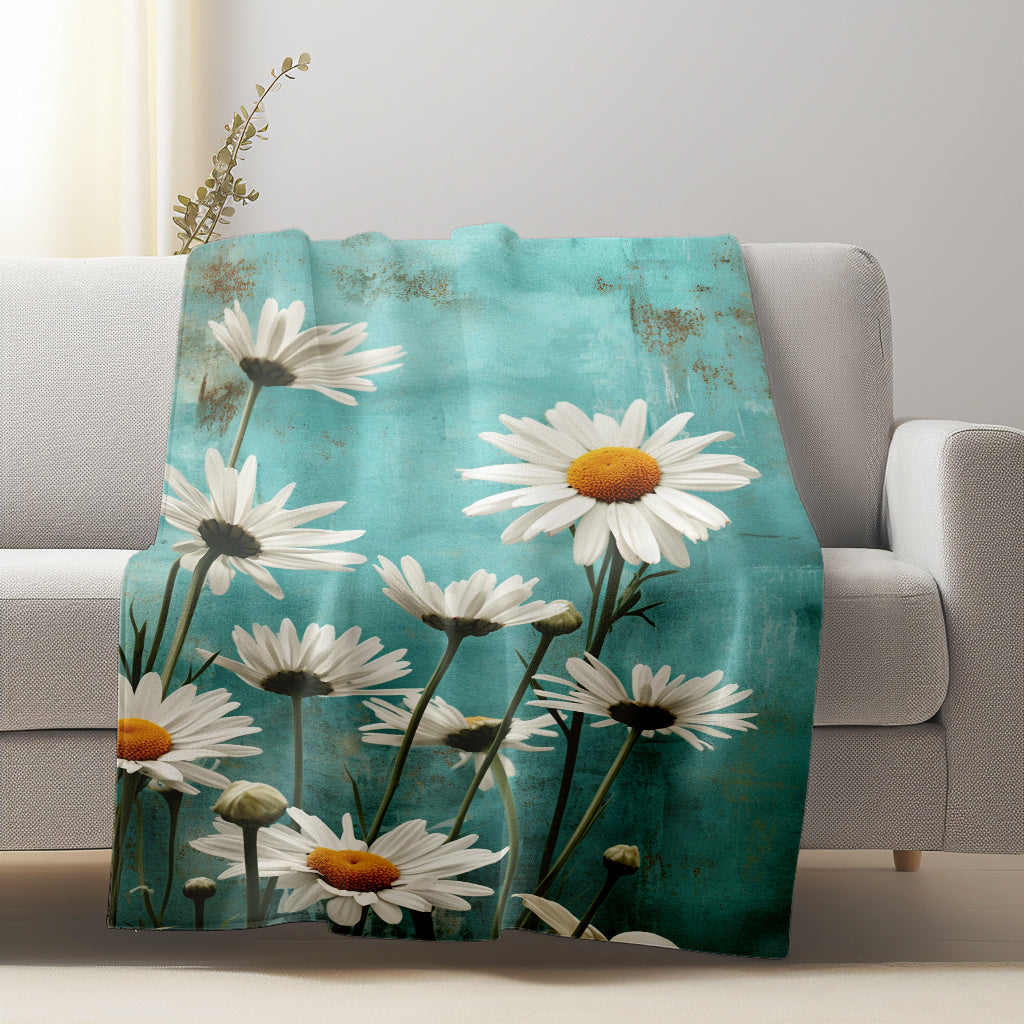 Soft and cozy Flannel Fleece Throw Blanket featuring a beautiful White Daisy Floral Pattern. This lightweight, all-season blanket is made of knitted polyester, making it perfect for use at home or while traveling. It is washable and can be used for