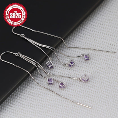 These trendy silver tassel earrings are perfect for those with sensitive skin. The long square design with tassel ear drops adds a chic touch to any outfit and can help to accentuate a slim face. The curved hook earrings are sure to add personality to