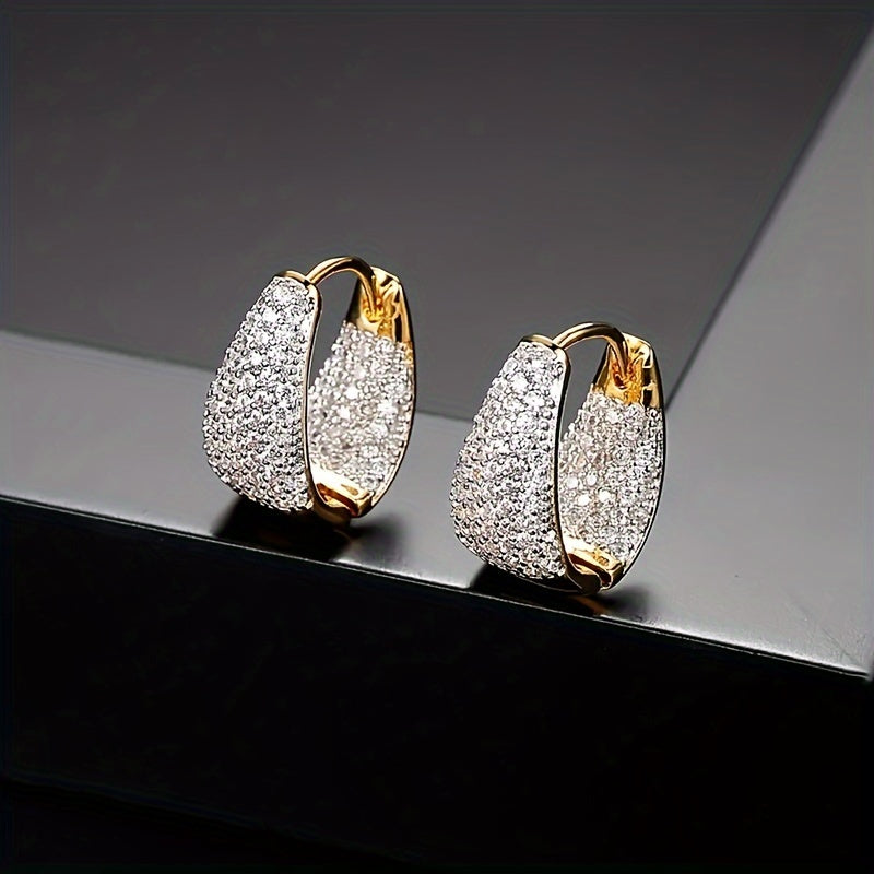 Stylish and versatile earrings adorned with sparkling zirconia, ideal for giving as a gift to friends or loved ones during the holiday season.