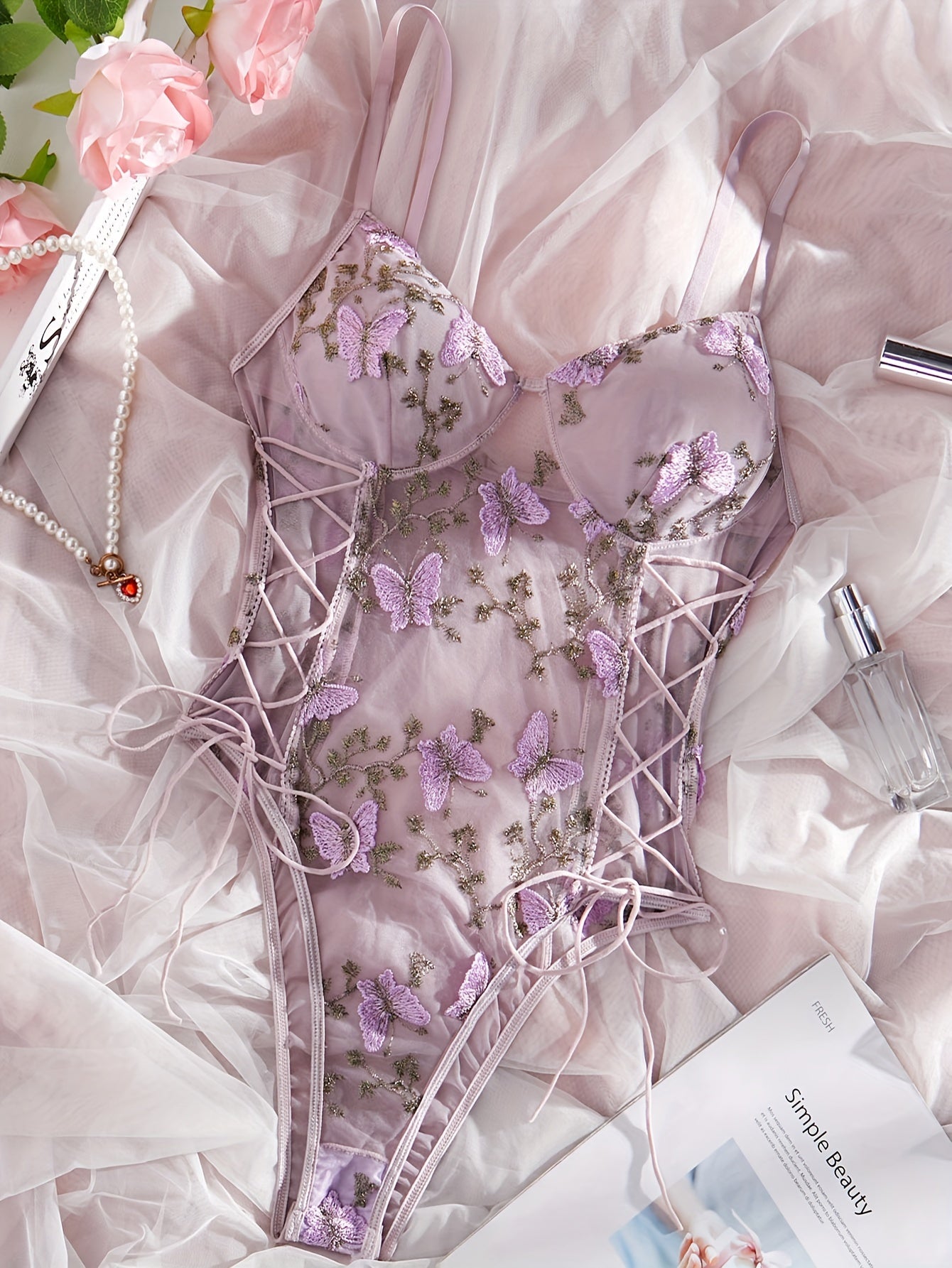 Purple butterfly embroidered teddy bodysuit with deep V-back, thong bottom, sheer mesh, hand washable, for women.