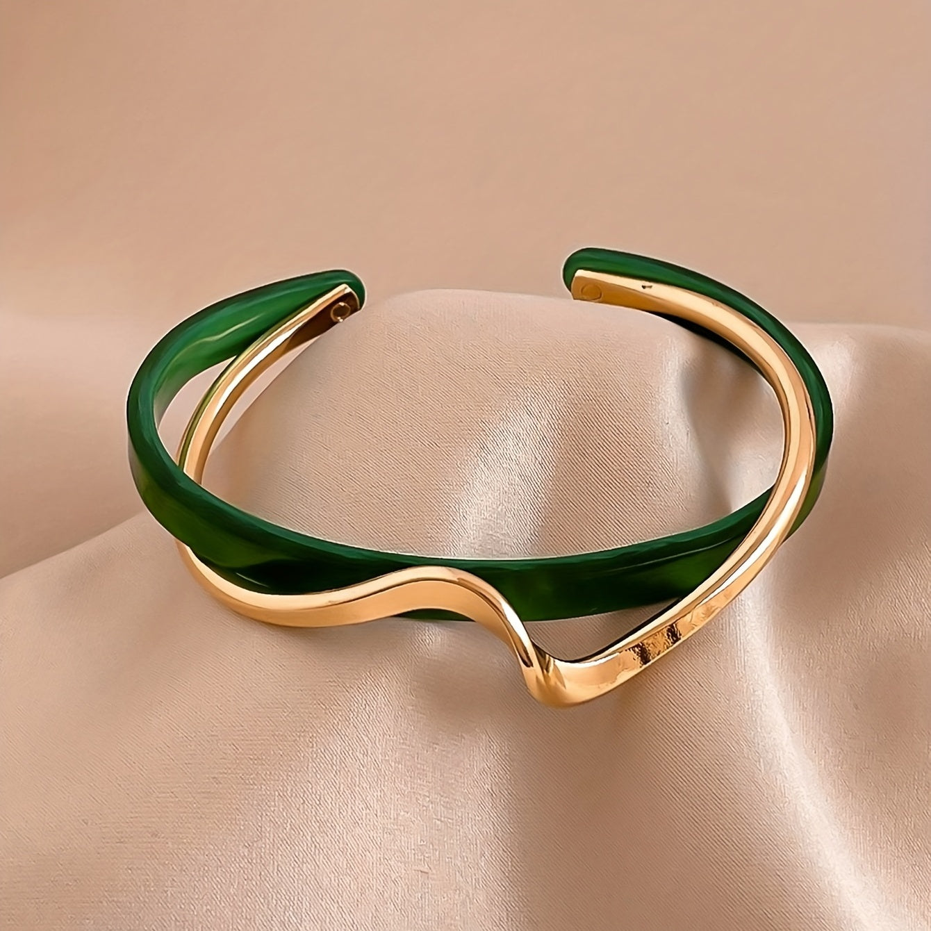 Wave-shaped cuff bangle with faux pearl inlay, featuring a minimalist style in 18K gold plating, ideal for women's jewelry collection