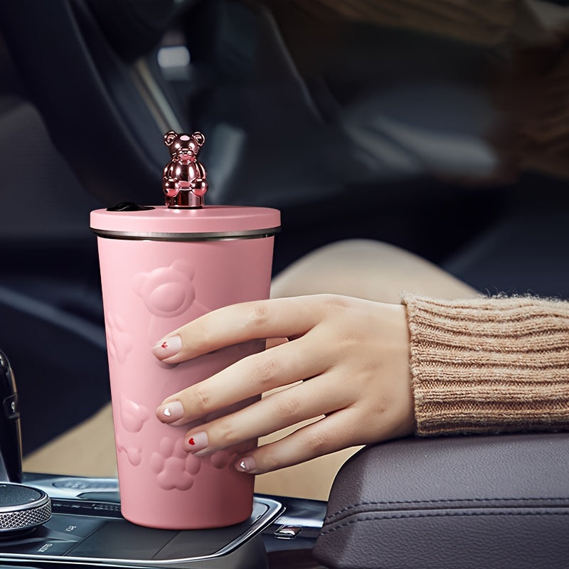 Stainless steel bear-themed coffee mug with straw for on-the-go use.