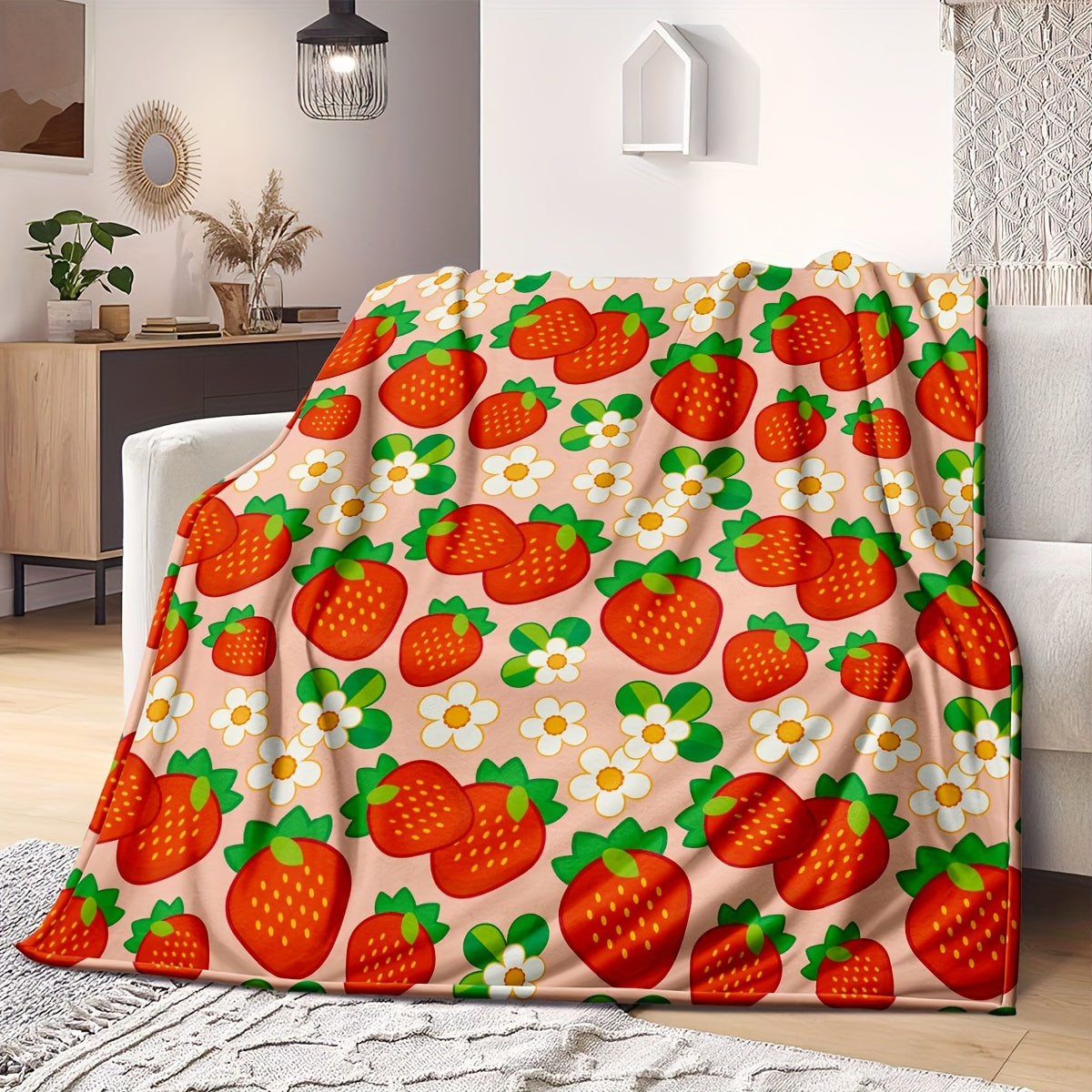 One piece of a cozy, all-season microfiber throw blanket in a rustic style, featuring a charming strawberry and flower pattern. This woven fruit-themed gift blanket is perfect for women.