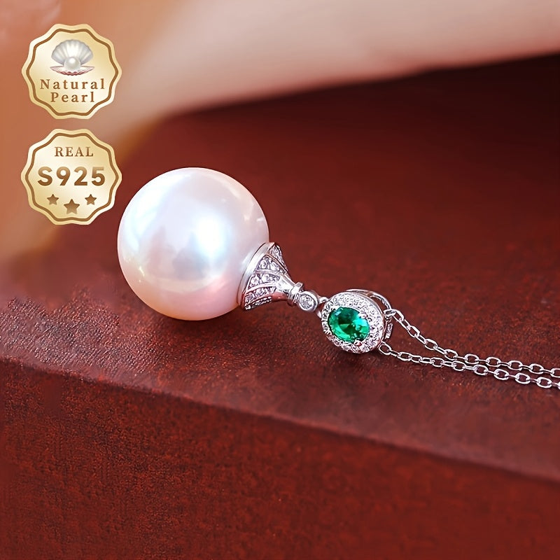 Give your loved one a special treat with this must-have gift box containing a stunning S925 silver pendant necklace featuring a 13-14mm round natural freshwater pearl. Each necklace is unique, with variations in natural pearls, shapes, and colors. The