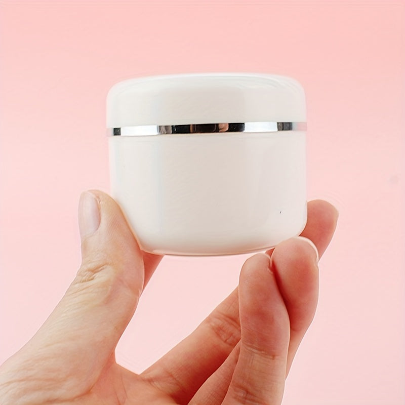 20pcs of 20ml white plastic cream jars are refillable sample bottles for cosmetics, makeup, and skincare, ideal for travel and storage.