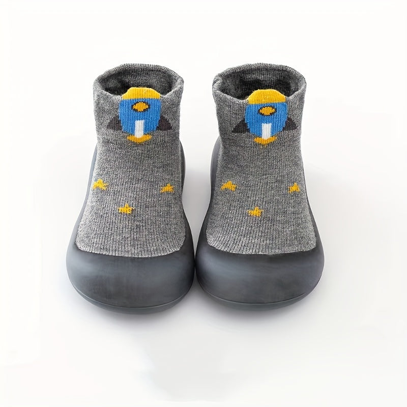 Cute lion cartoon slip-on sock shoes for baby boys in light blue with yellow accents. Soft, breathable, and non-slip rubber sole, perfect for first walkers in spring and fall.