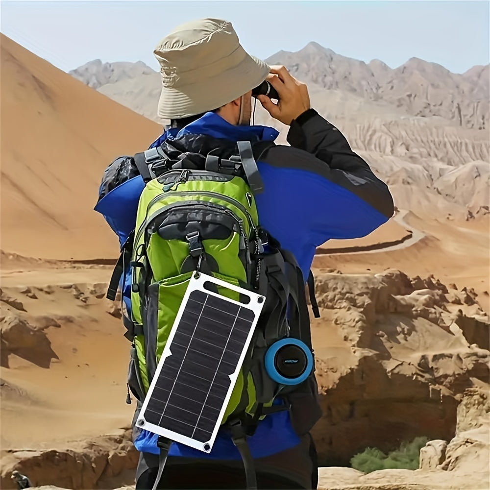 Compact dual USB solar charger, perfect for camping and home use.