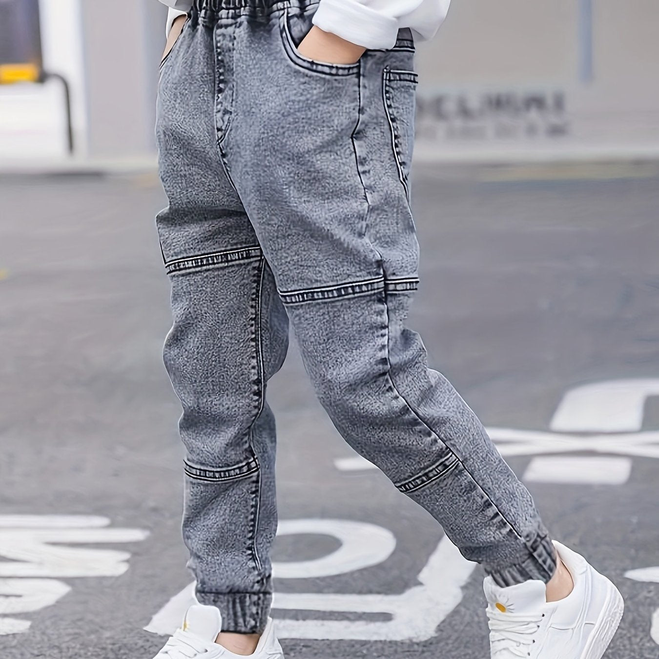 Boys' versatile denim pants with patch detailing for all seasons.