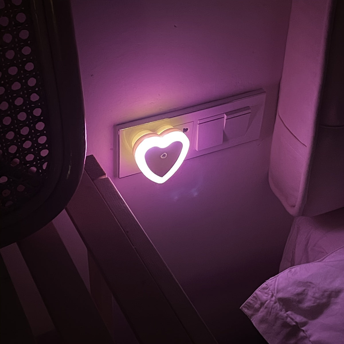 Heart-shaped LED night light with built-in sensor and European plug for indoor use. Ideal for stairways, bedrooms, kitchens, and hallways. Not waterproof. Can be wall-mounted.