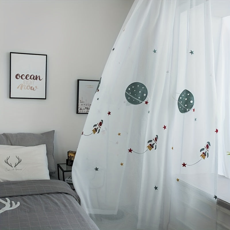 A navy blue faux linen curtain with cartoon embroidery, paired with a white outer space cartoon tulle sheer curtain for bedroom window treatment.