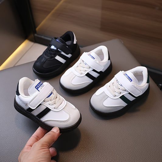 Minimalist unisex toddler sneakers with solid color, adjustable strap closure, slip-resistant sole, and breathable fabric.