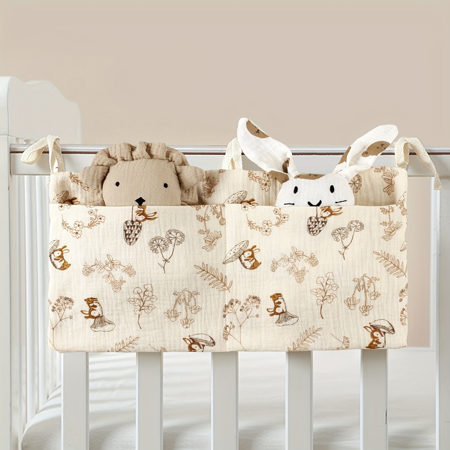 Double-layer fabric hanging storage bag with two stroller pockets, ideal for holding baby bottles with printed patterns.