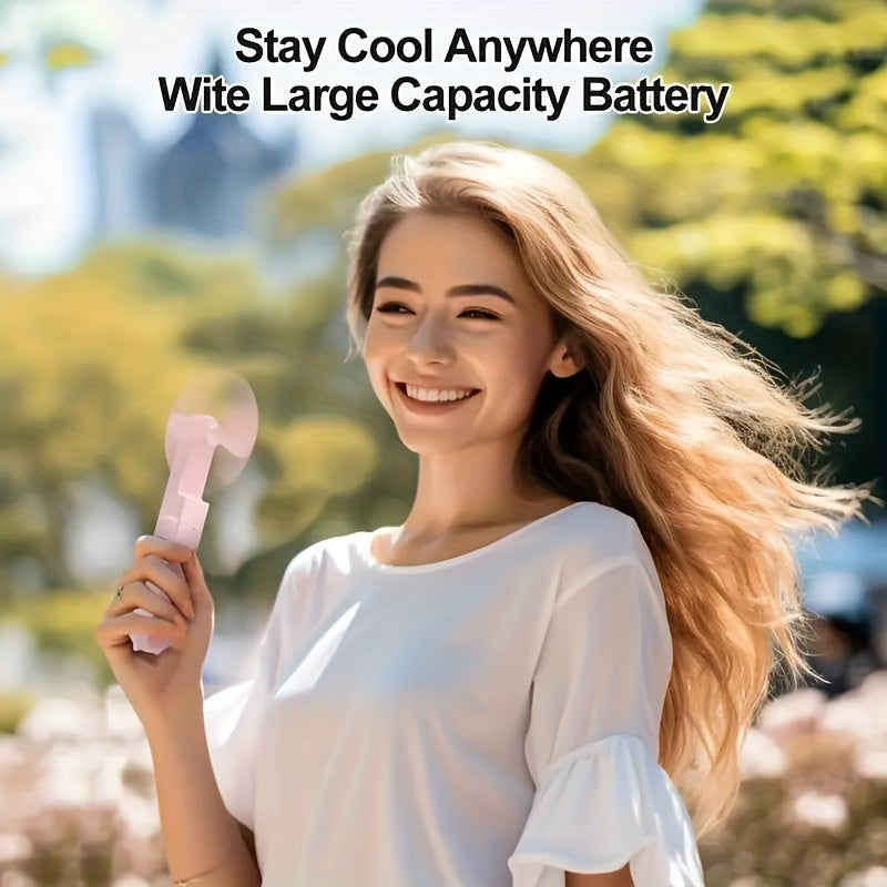 Compact handheld fan that is rechargeable via USB, with adjustable speed settings and a foldable design, perfect for women on the go during travel or outdoor activities.