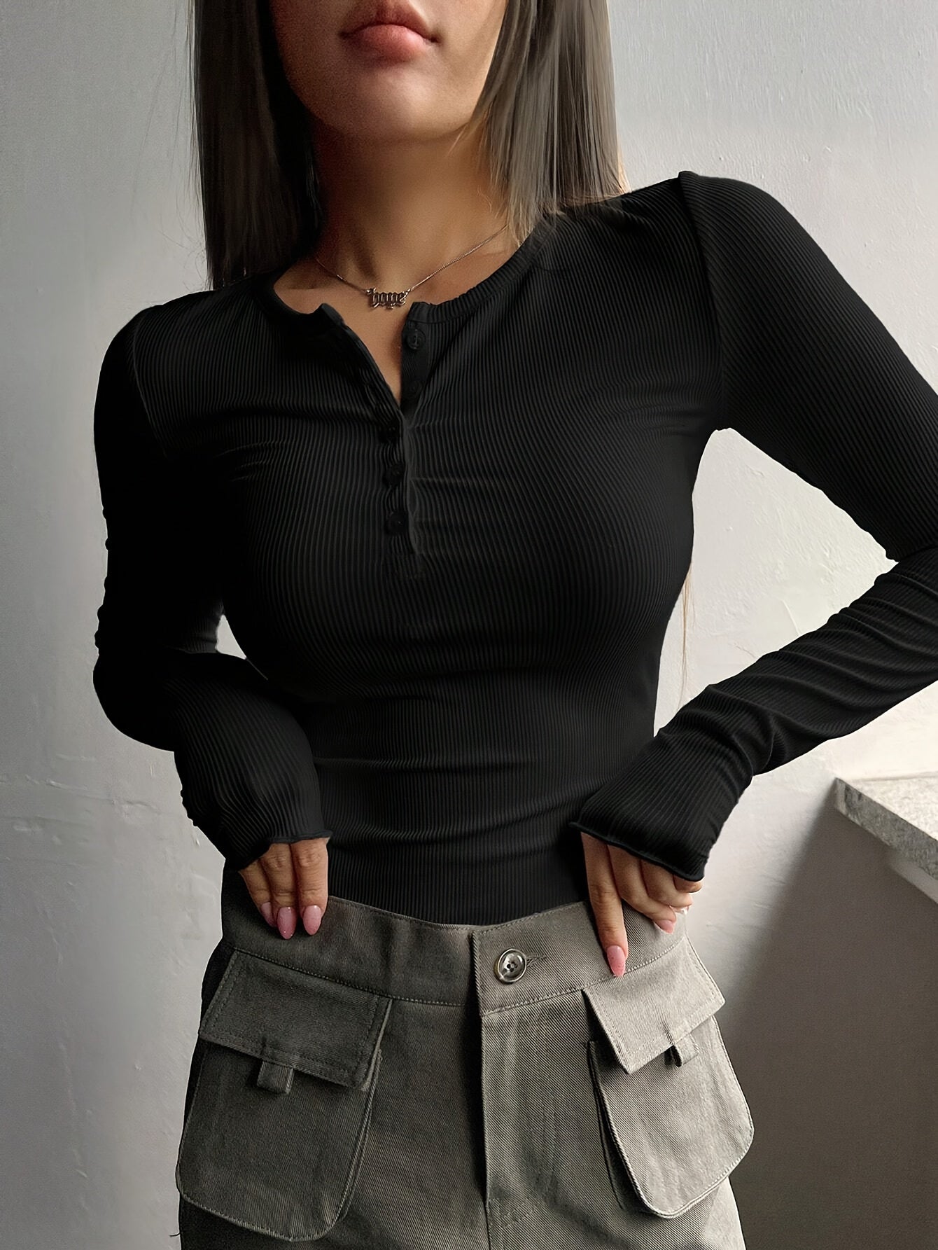 Women's black ribbed knit T-shirt with half-button placket, slim fit, machine washable, suitable for spring/summer.