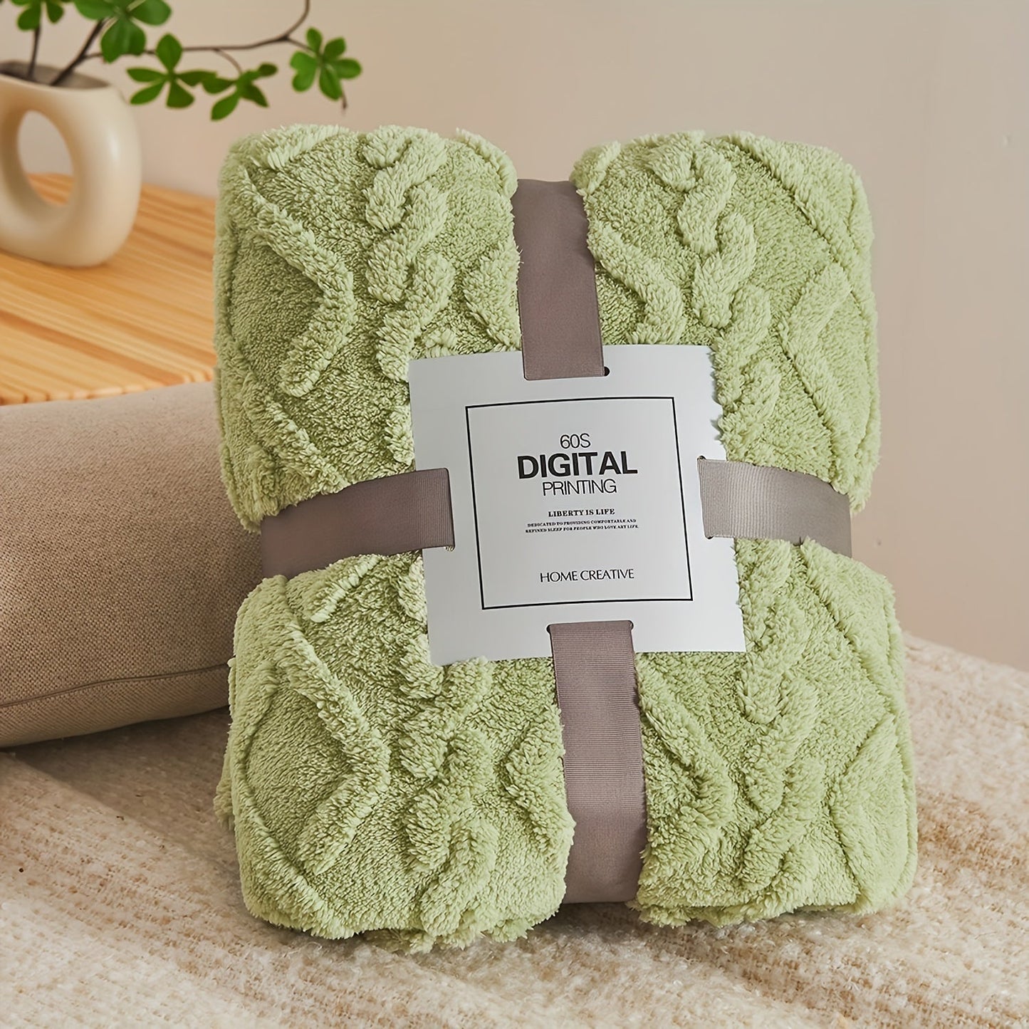 Stay cozy all year round with the July Casa Ultra-Soft Jacquard Velvet Blanket. This thick, reversible throw is perfect for any season and is machine washable for easy cleaning. Available in a beautiful green color.