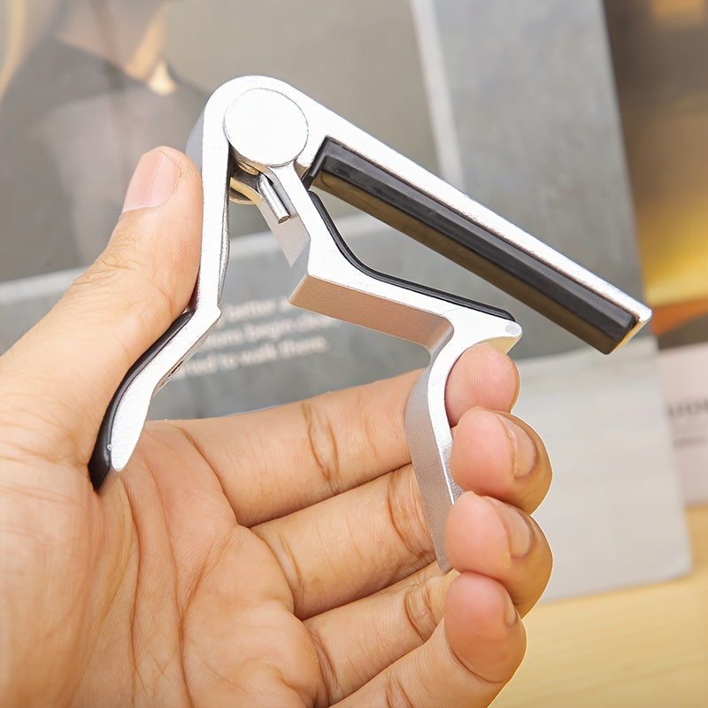 Aluminum alloy guitar capo for acoustic, classical, electric guitars and ukuleles, quick change with tone adjustment.