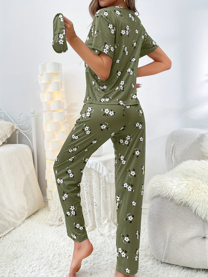 Women's floral pajama set with short sleeve top and elastic waistband pants.