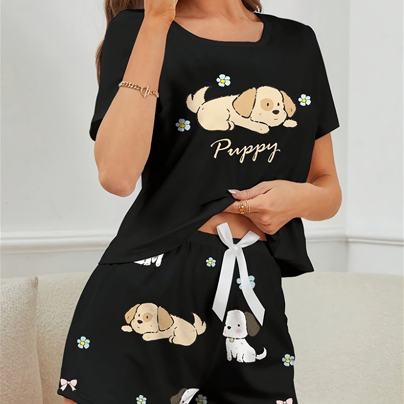 Women's Puppy Print Pajama Set. Cute cartoon design with short sleeve top and shorts for a comfortable fit.