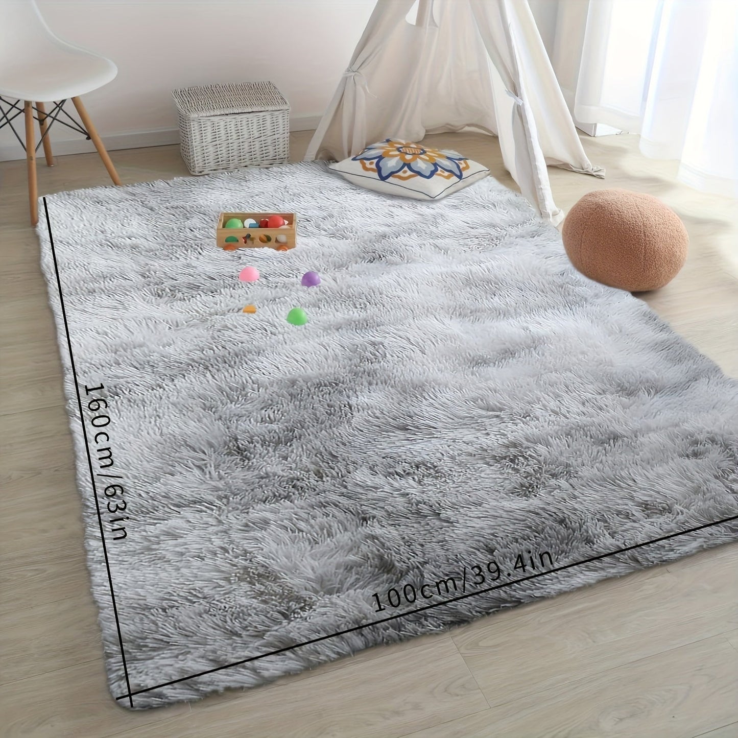 Soft and cozy shaggy area rug perfect for bedroom or living room decor. This plush light gray rug measures 160.02cm x 80.01cm and features a rectangular tie-dye design. Made of machine-washable polyester, this rug is ideal for dorm rooms and homes. Add a