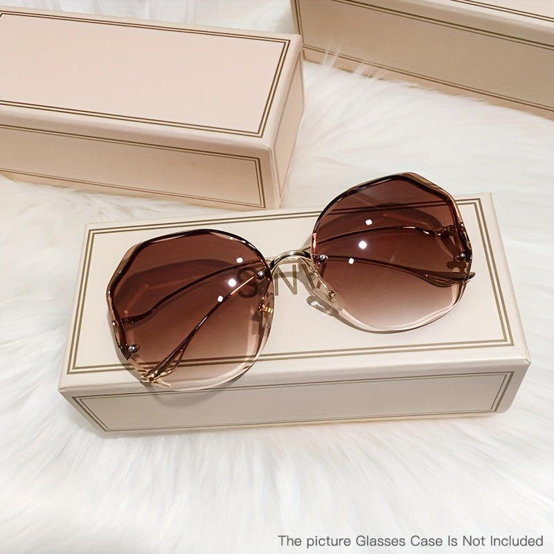 Luxury frameless round glasses for women with stylish gradient lenses and metallic finish.