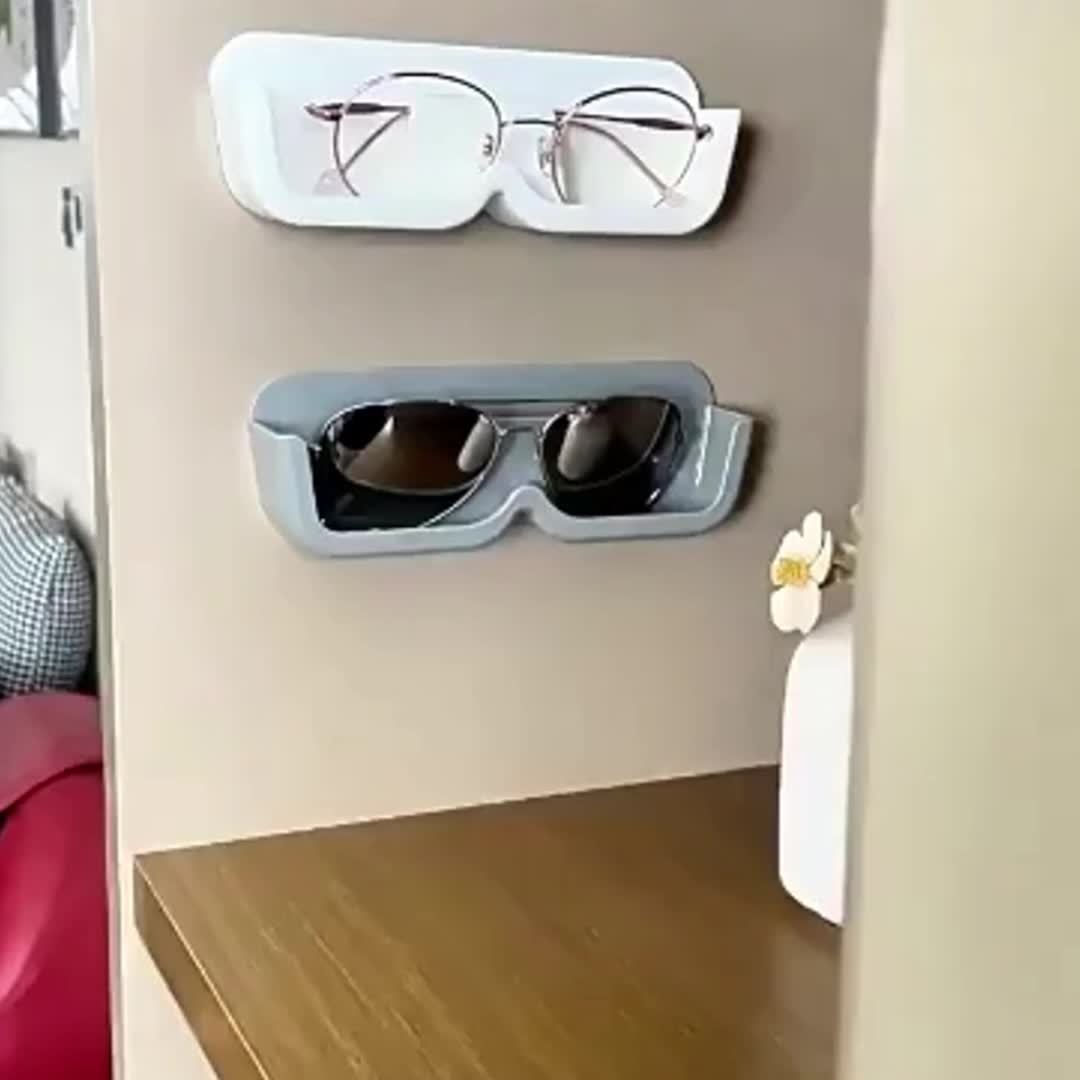 1 piece of Space-Saving Wall-Mounted Eyeglasses Holder, Stylish Display & Storage Tray without the need for drilling, made of plastic. Ideal for organizing women's fashion accessories and eyewear.