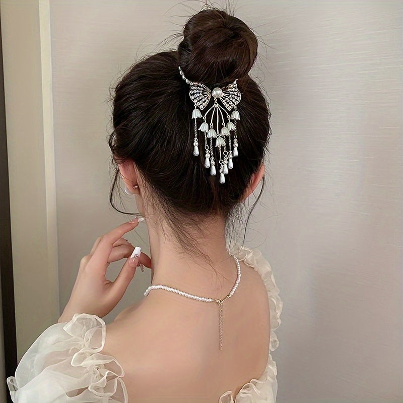 Retro rhinestone and imitation pearl hairpin for bun hairstyles.