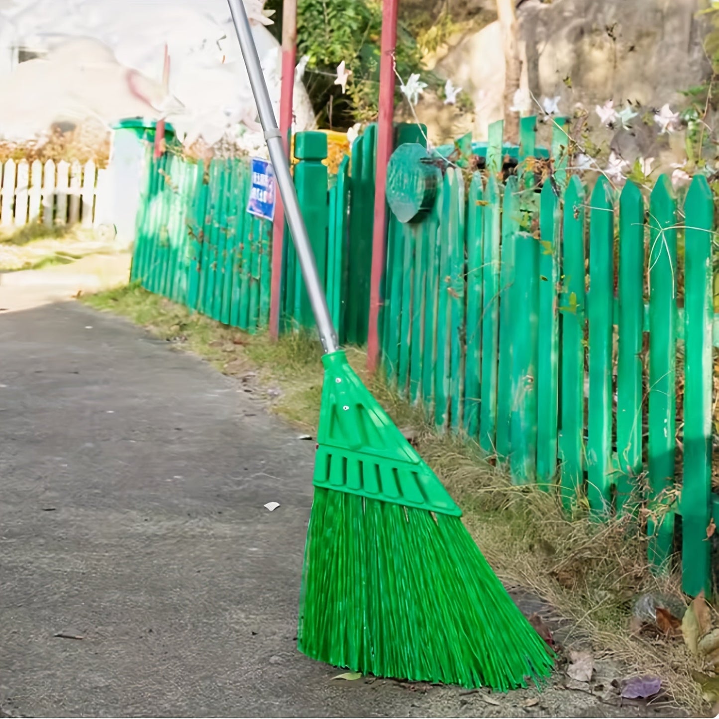 Long-handled outdoor commercial angle broom ideal for courtyards and hard floors.