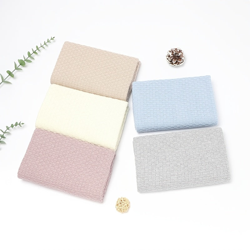 Dreamwrap is an ultra-soft knit blanket designed for youngsters. This solid color blanket is perfect for use in cribs and strollers. It is recommended to hand wash only. Available colors include gray, white, and pink.