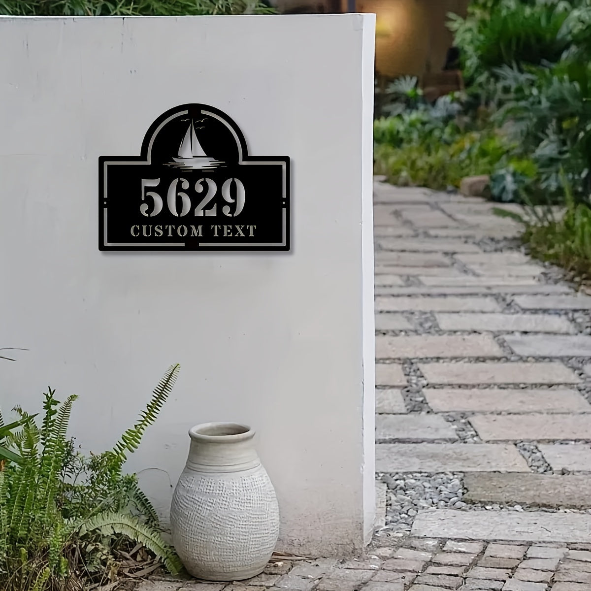 Customize your iron house number plaque with your street name and address. This metal address sign is perfect for home decor and makes a great housewarming gift for anyone ages 14 and up. Can be easily mounted on the wall.