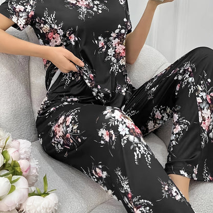 Women's floral print pajama set with short sleeve round neck top and elastic pants for casual wear.