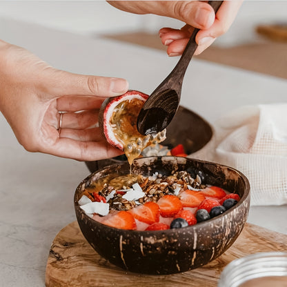 one set of 4: two coconut bowls, two wooden spoons, ideal for healthy vegetarian salads and ice cream, made from natural coconut.