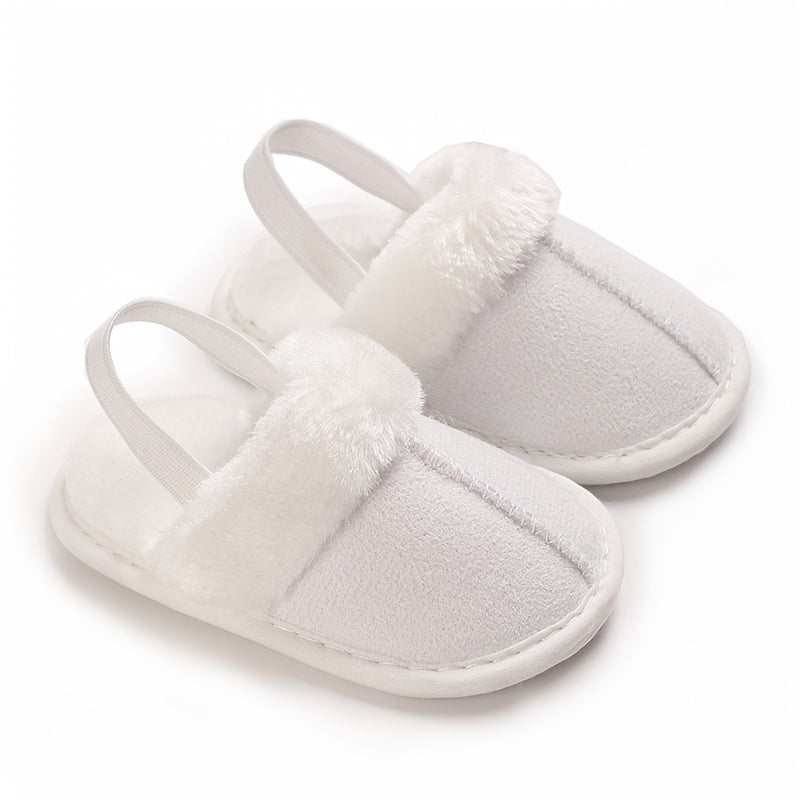 Soft and cozy plush baby girl slippers with non-slip sole for indoor comfort, perfect for 0-1 year olds in spring and fall.