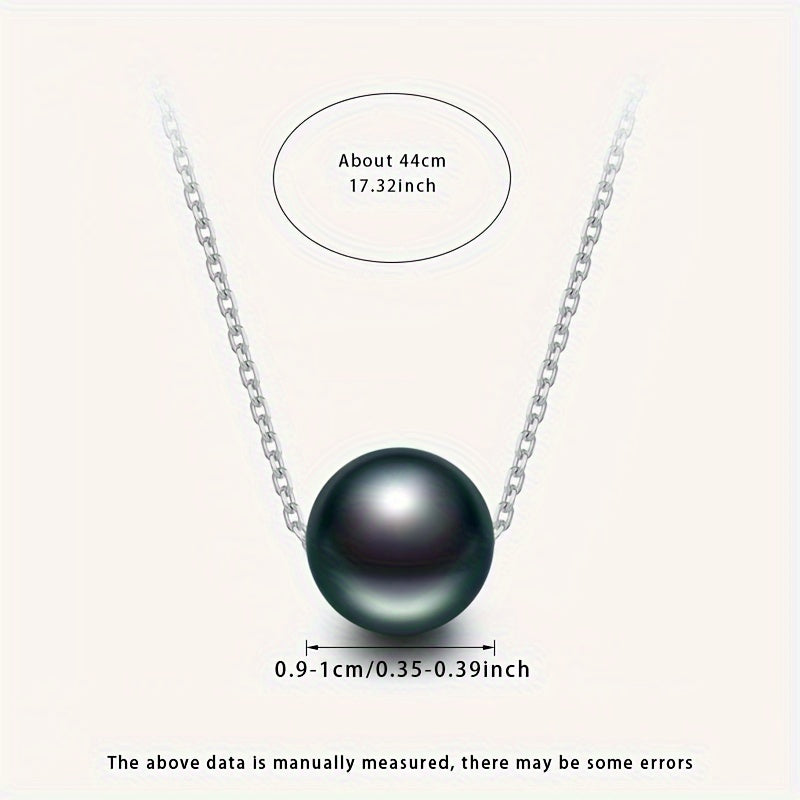 This necklace features a stunning large grain round Tahitian black pearl pendant suspended on a S925 silver chain. Each pearl is unique, so the color and shape may vary. This simple yet elegant piece is perfect for any woman's fashion collection and