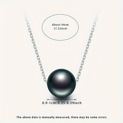 This necklace features a stunning large grain round Tahitian black pearl pendant suspended on a S925 silver chain. Each pearl is unique, so the color and shape may vary. This simple yet elegant piece is perfect for any woman's fashion collection and